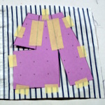 Tape the pattern to the fabric